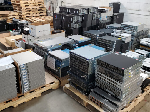 Palletized data center networking infrastructure, blade servers, and server enclosures staged for IT asset disposition transport